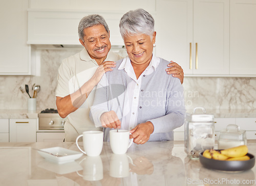 Image of Coffee, couple and love with a senior woman and man enjoying retirement while together in the kitchen of their home. Happy, smile and romance with an elderly male and female pensioner making tea