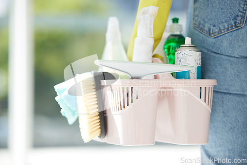 Image of Home, cleaning and chemical products in a bucket for home care work and spring clean routine. Macro of cleaner with detergent spray, bottles and tools to scrub the interior of household.