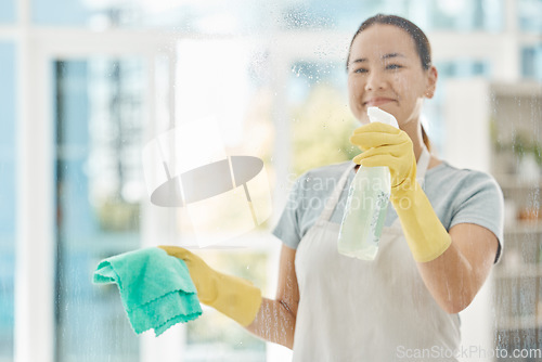 Image of Housekeeping, products and happy woman cleaning the windows with detergent, cloth and gloves. Maid, cleaner or domestic worker washing the dust and bacteria off the glass in an apartment building.