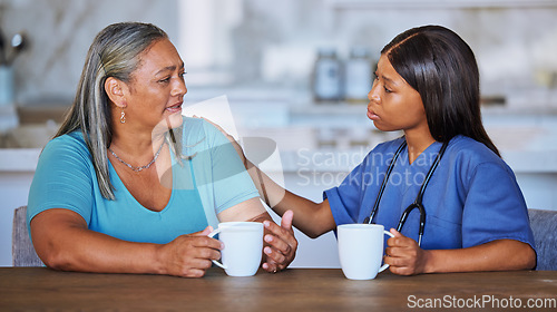 Image of Black woman, nurse or elderly patient support, talking or comfort. Medical consultant, caregiver or female doctor having conversation with elderly woman at nursing home for trust, advice or help.
