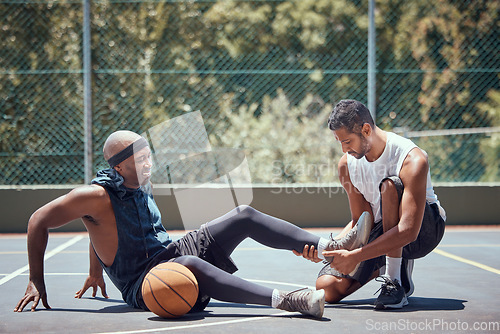 Image of Injury, physiotherapist and basketball player with help support during sports game, first aid help on court and emergency during training. Athlete with muscle pain and medical coach after accident