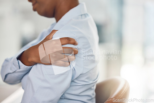 Image of Black woman, shoulder pain and office injury from stress, burnout and target pressure. Zoom on hand, business worker or employee worried about muscle pressure from furniture chair and working posture