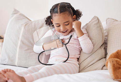 Image of Happy girl, doctor stethoscope and listening to heartbeat sound with excited smile at play learning. Young and curious child with healthcare exam equipment smiling with joy in home bedroom.