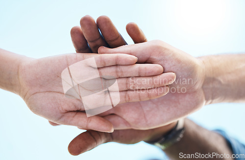 Image of Teamwork, motivation and diversity with people hands stacked with blue sky, lens flare background and mock up. Group support, community or workers standing together for goal, trust and collaboration