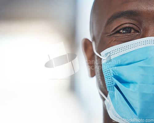 Image of Black man doctor with covid face mask face portrait for African healthcare insurance. Sad, fear and risk in eye of a medical worker with safety gear for human surgery during corona virus pandemic