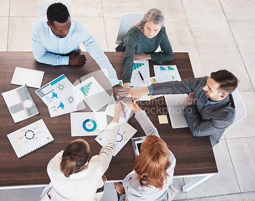 Image of Team, hands together and meeting collaboration about analytics of sales revenue, growth and group development project. Top view, global and business people planning our vision, target and mission