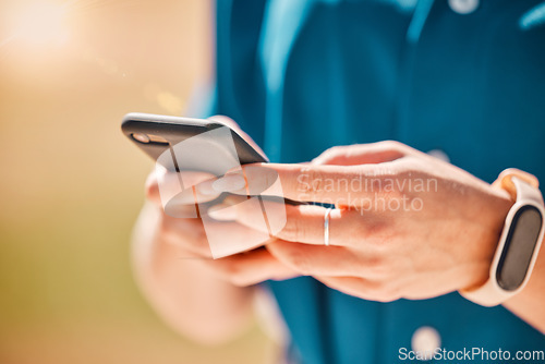 Image of Woman hands on a phone for communication, social media and connection with technology closeup. Girl browsing on social network, doing research on the internet or typing a message with a smartphone