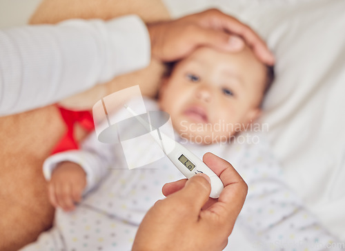 Image of Thermometer, covid and sick baby in bed with parents hand on their forehead checking for fever or flu at home. Worry, care and person caring for a little child testing for illness or cold problem