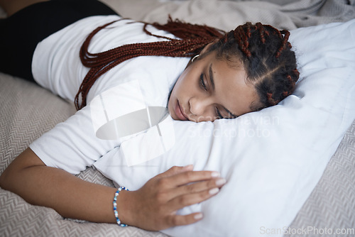 Image of Sad girl, mental health problem and bedroom rest with depressed thoughts and personality disorder. Hopeless young woman suffering with depression, despair and psychosis risk alone on bed.