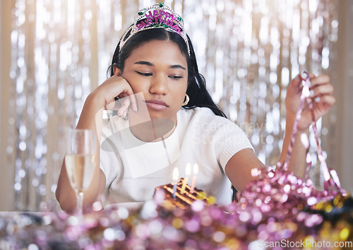 Image of Sad, lonely and depression woman birthday party event celebrate in isolation. Frustrated, waiting and anxiety young emotional female looking depressed, bored and angry about failed moody celebration