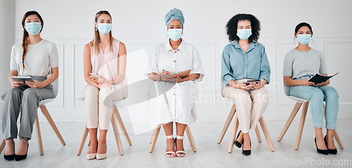 Image of Compliance, recruitment and covid laws with business women waiting for an interview at corporate office. Hiring, corona and social distance with diverse group practice safety at company together