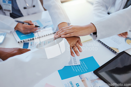 Image of Collaboration, team and hands of doctor in meeting working on research for medical study or surgery. Teamwork, support and partnership for group of hospital healthcare worker with medicine documents