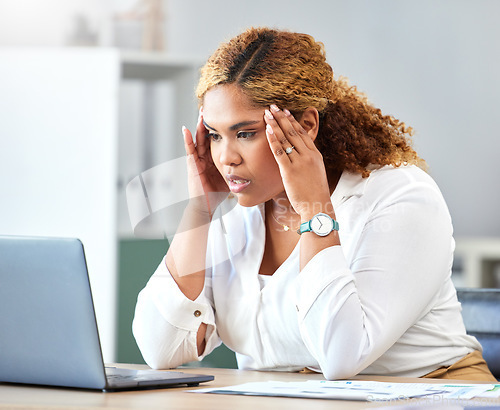 Image of Stress, headache and tired business woman working on a report with a laptop in her modern office. Overworked, frustrated and corporate employee planning a company strategy document with a computer.