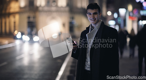 Image of Smiling Meedle Eastern man walking down street near modern office building,