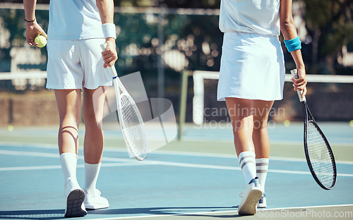 Image of Tennis, fitness and friends walking on court to start a competitive game outdoors in summer together. Sports, woman and players ready for cardio workout, training and healthy exercise at country club