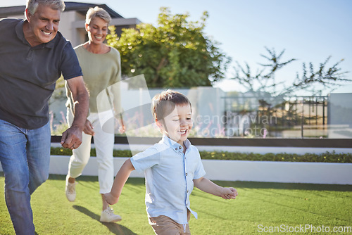 Image of Family, grandparents and running with child in garden for happy, health and love together. Care, motivation and summer with elderly couple and kids on grass for youth, smile and game in neighborhood