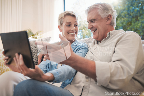 Image of Tablet, love and senior couple with woman and man online for social media, video call or watching series and movies. Happy, smile and fun with an elderly male and female pensioner in a living room