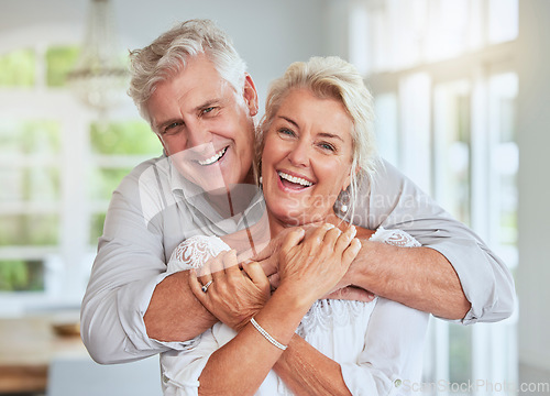 Image of Love, couple and retirement with a senior man and woman looking happy and hugging in their home together. Smile, romance and relationship with an elderly male and female pensioner in a house