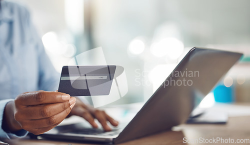 Image of Ecommerce, online shopping and credit card payment on a laptop via the internet for easy and fast digital cash exchange. African persons hands typing banking information on fintech to transfer money