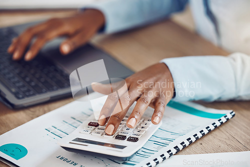 Image of Calculator, accounting and financial accountant with finance documents to check sales revenue of the company in an office. Data analysis, inflation and African employee working on budget spreadsheet