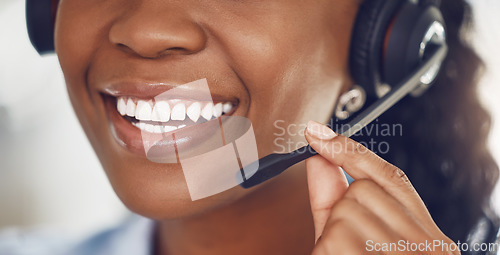 Image of Call center agent, smile and black woman telemarketing operator or consultant talking on headset for customer service. Closeup mouth of happy female worker in contact us and crm support company