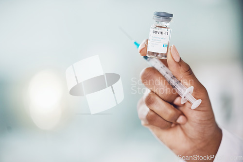 Image of Covid, vaccine and medicine with the hand of a doctor holding medication and working in a hospital. Medical, healthcare and insurance with a cure, treatment or dose in the hands of a nurse inside