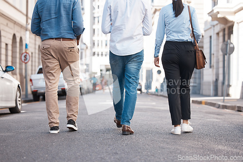 Image of Friends, walking and city with a woman and men on a walk together outside in the city. Friendship, commute and travel with a friend group outdoor in town for exploration and sightseeing in the day