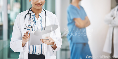 Image of Indian woman doctor with tablet for medical data in digital online web medicine, innovation tech and medicare app research. Healthcare lady on mobile internet or site for health lab exam test results