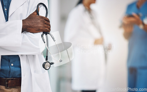 Image of Hands, stethoscope and black man medical doctor at hospital to help, consulting research and healthcare exam. Male cardiologist professional with innovation medical tool for cardiology lab test work