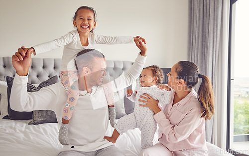 Image of Comic family, happy and bedroom portrait while relax in home together, smile for parents love and international hotel holiday. Excited kids with mother and father on holiday and being playful in bed