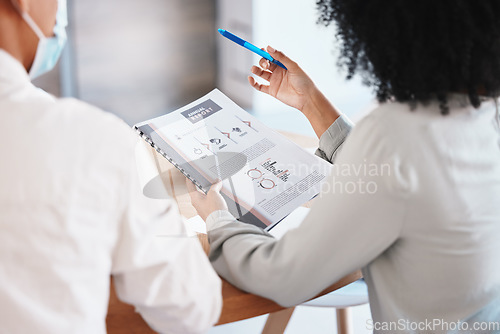 Image of Finance, growth and report with a business woman reading a document during a meeting in the office. Accounting, teamwork and strategy with a corporate female employee holding a file or folder at work