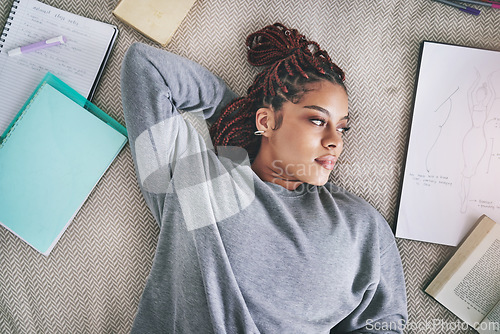 Image of Design, fashion student and black woman on bed lost in ideas. Relax, thinking and inspiration, thoughtful young designer on break from school work. Creative student with books and drawing in bedroom.