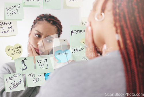 Image of Sticky notes, mirror and woman taking a picture on a smartphone with a sad and confused face. Upset and unhappy girl reading motivational, positive affirmation and self care post it reminder.