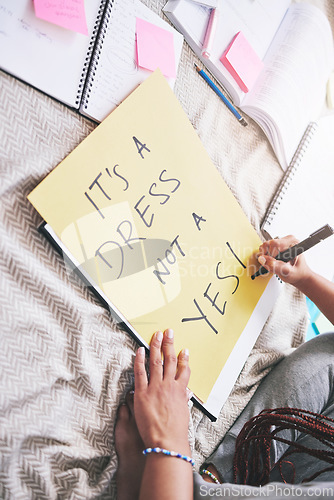 Image of Woman activism, writing and sexual assault protest message for bold and angry statement poster. Girl sharing opinion and thought about rape problem with frustrated, protesting words on paper.