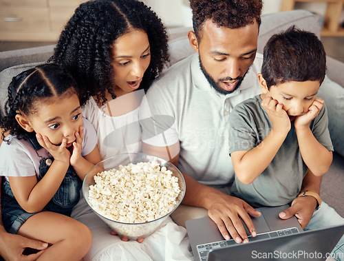 Image of Family time, laptop and popcorn while watching a movie, streaming cartoons and looking shocked, surprised and scared. Wifi connection, online tv and bonding with kids, man and woman on couch at home