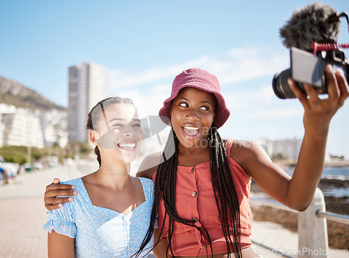 Image of Influencer woman friends on beach live streaming beach holiday or vacation for social media in city, summer and blue sky. Gen z girl couple or people in selfie portrait or outdoor podcast near ocean
