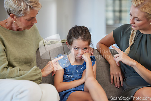 Image of Angry family, discipline and sad children at home for naughty, stubborn and bad behavior problem. Moody girl kid with adhd, fear and anxiety in conflict fight with frustrated mother and anger grandma