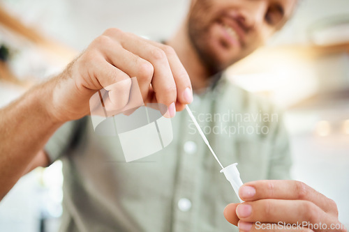 Image of Hands of man with home covid test to check for corona virus infection with medical health kit during pandemic. Patient, healthcare and sick man checking for flu risk with rapid covid 19 swab testing