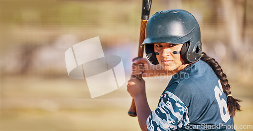 Image of Baseball woman, game face and ready to hit ball with bat on a field. Sports player with eye paint, waiting to strike and concentration to win match by competitive female batter focus during training