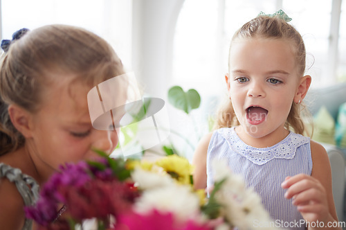 Image of Excited, wow and children looking surprised looking at flower bouquet surprise for birthday, mothers day or valentines day. Girl kids or sibling sisters happy and playful with spring flowers at home