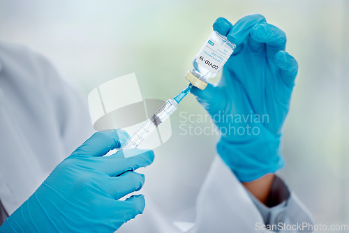 Image of Hands of doctor with covid vaccine and needle for help, support and safety protection from covid 19 pandemic. Medical healthcare worker, hospital nurse or corona virus expert with medicine innovation