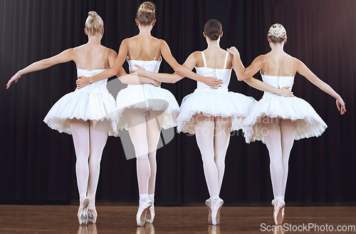 Image of Ballet women at stage dance performance or show performing elegant abstract dancing routine back view. Collaboration, teamwork and ballerina dancer team working together in creative beauty recital