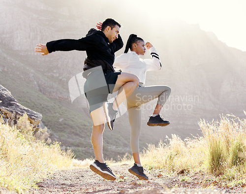 Image of Couple exercise fitness in Los Angeles park, jump stretching body and outdoor cardio workout on path. Black woman athlete in marathon training with man, runners on mountain range and action energy