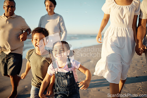 Image of Happy family, beach vacation and children running during fun active activity in summer with parents and grandparents. Laughing, bonding and chasing joy while men, women and kids playing on holiday