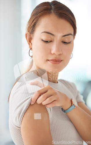 Image of Healthcare, covid and vaccine with woman and bandaid on arm for medical, patient and wellness against virus. Medicine, support and health with girl after vaccination for sick, flu or illness