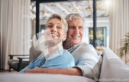 Image of Love, couple and retirement with a senior woman and man on a sofa to relax in their home together. Happy, smile and thinking with an elderly male and female pensioner in the living room of a house