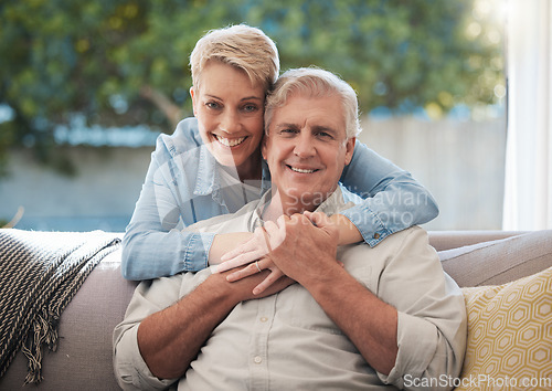 Image of Couple, love and senior man and woman sitting on a sofa in the living room and enjoying retirement. Portrait of an elderly male and female pensioner in a home to relax and spend time together