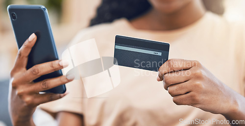 Image of Black woman with a phone uses credit card for digital, online shopping and to buy ecommerce goods. Web security technology makes paying bills using fintech easy, simple and safe for retail customers