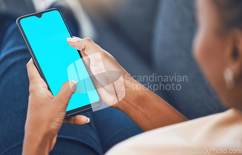 Image of Black woman, hands and phone with green screen mockup for marketing, branding and advertising. African female hand on mobile technology with blank display for social media, texting and message or app