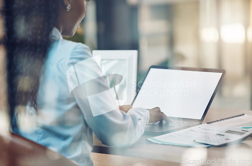 Image of Editor with mockup laptop screen typing report in office at night with the online research result. Business woman send new idea to manager via email and reading internet data and proposal in a office